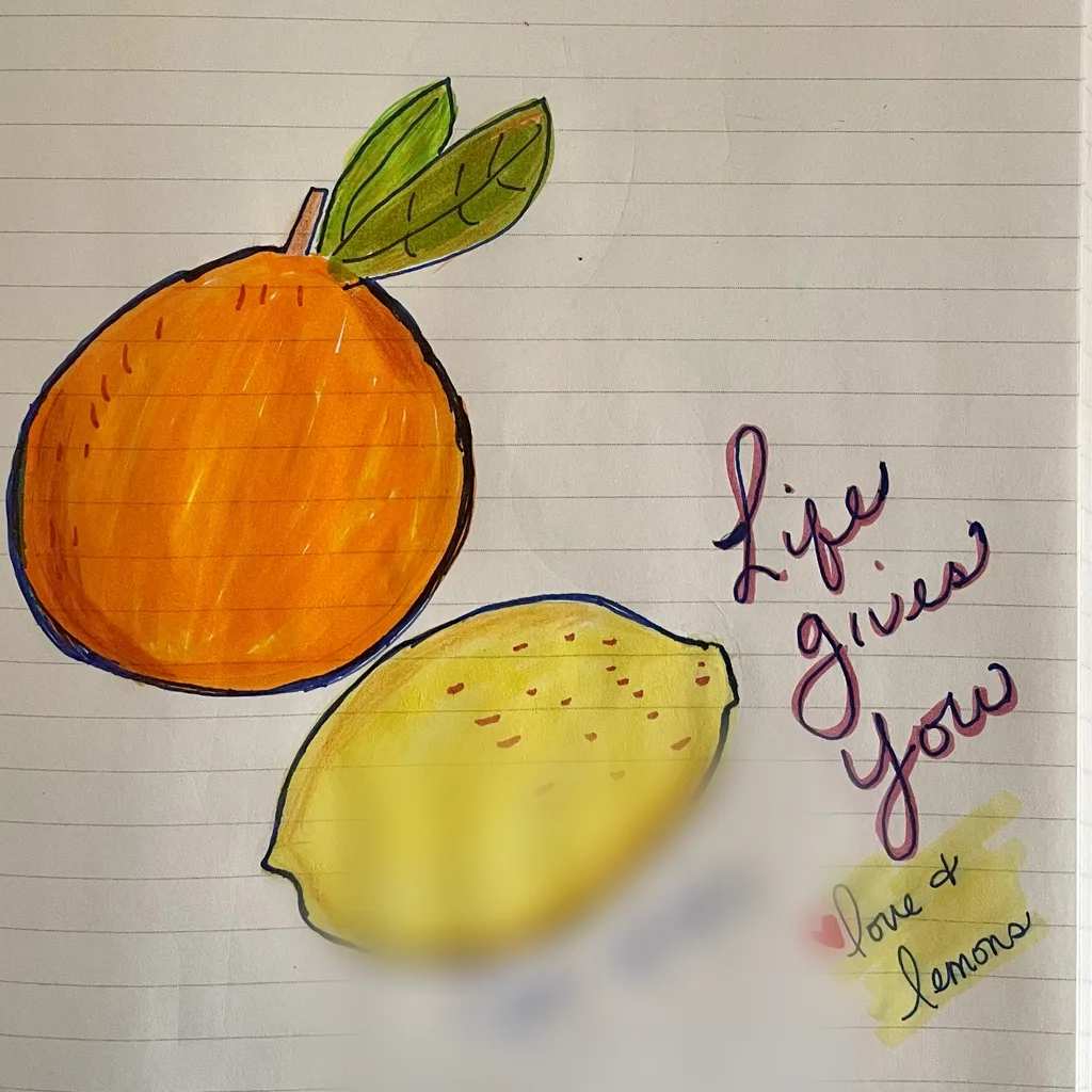 Her marker drawing of an orange and a lemon, with 'Life gives you love & lemons' written beside them.